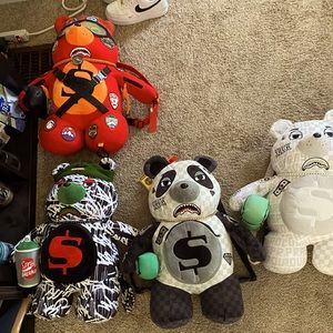 Four Sprayground bear bags.